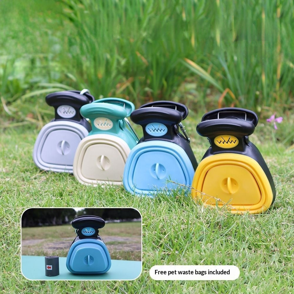 Dog owner using foldable poop scooper outdoors